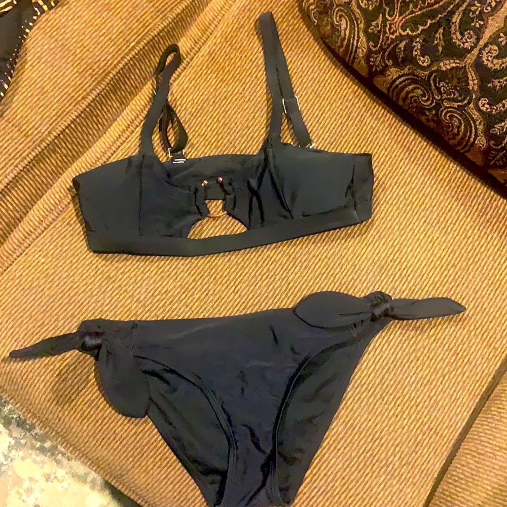 Never worn only washed no tags .Swimsuit Medium bottoms and top is a Small
